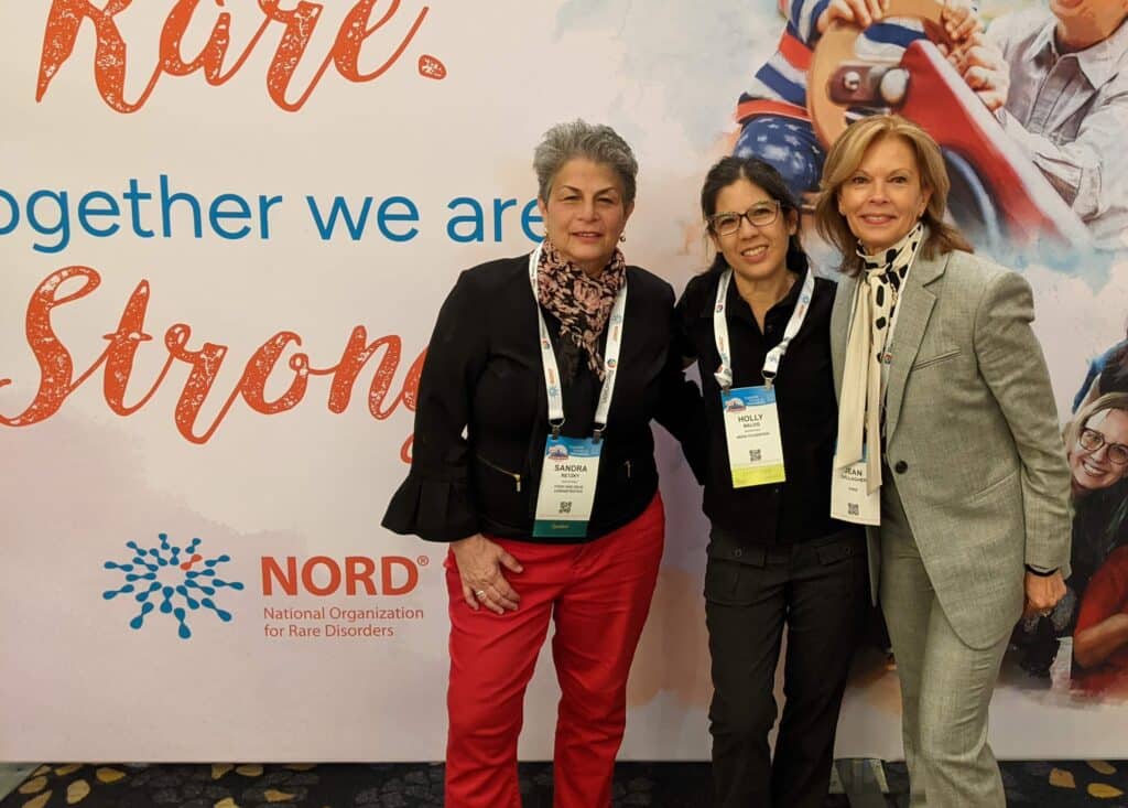 group of women standing in front of NORD signage